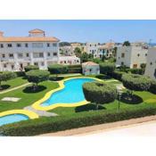 Holiday property with terrace access to textile swimming pool and beach front